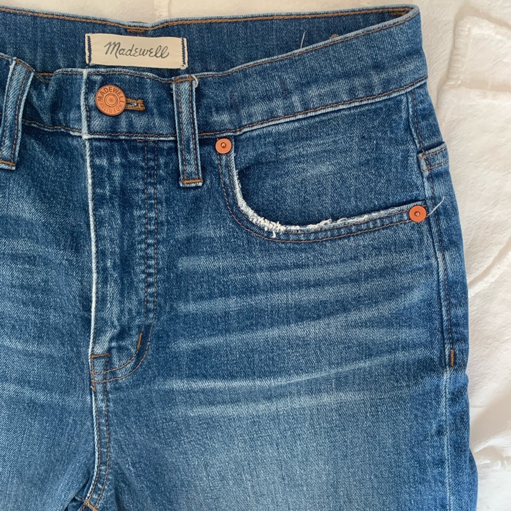 Flared darker blue jeans
